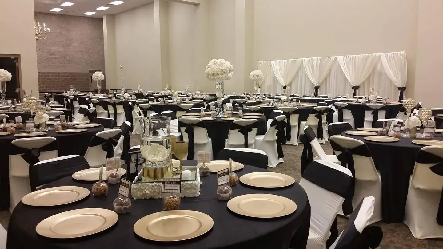 Champion Hall arranged with black and gold banquet tables