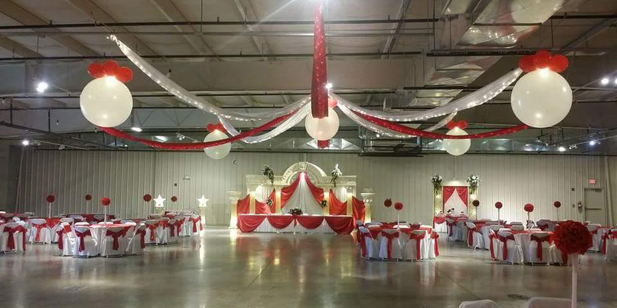 Detailed banquet setup with red tablecloths at the Northern Indiana Event Center.